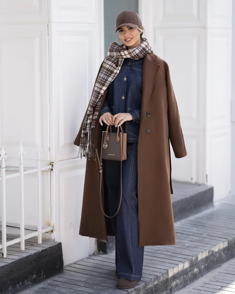 Chocolate Brown Long Coat with a Plaid Scarf and Dark Jeans