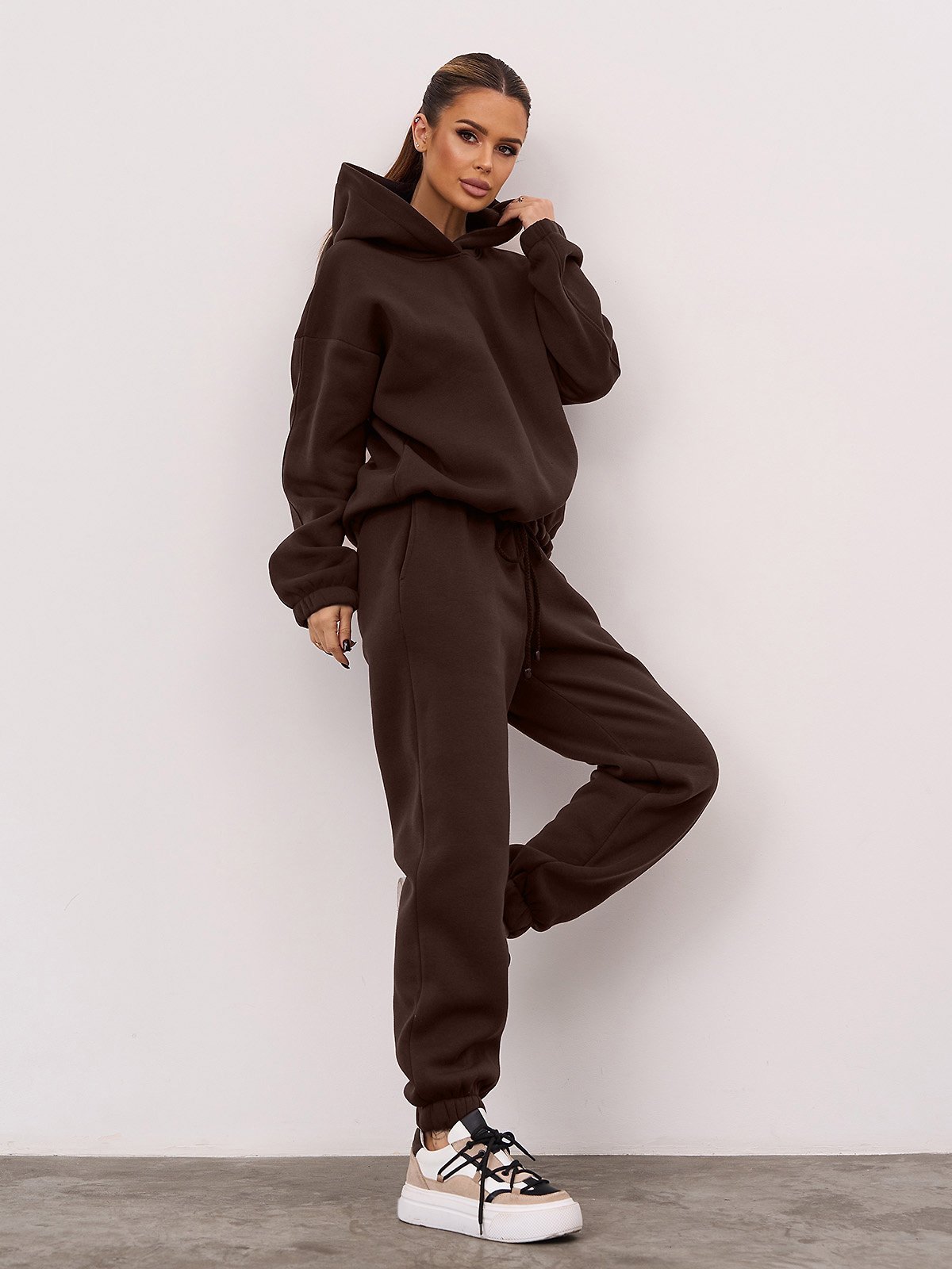 33 Chocolate Brown Knit Outfits for January Weekends That Are Chic, Warm and Elegant 18 Chocolate Brown Knit Hoodie Set with Chunky Trainers