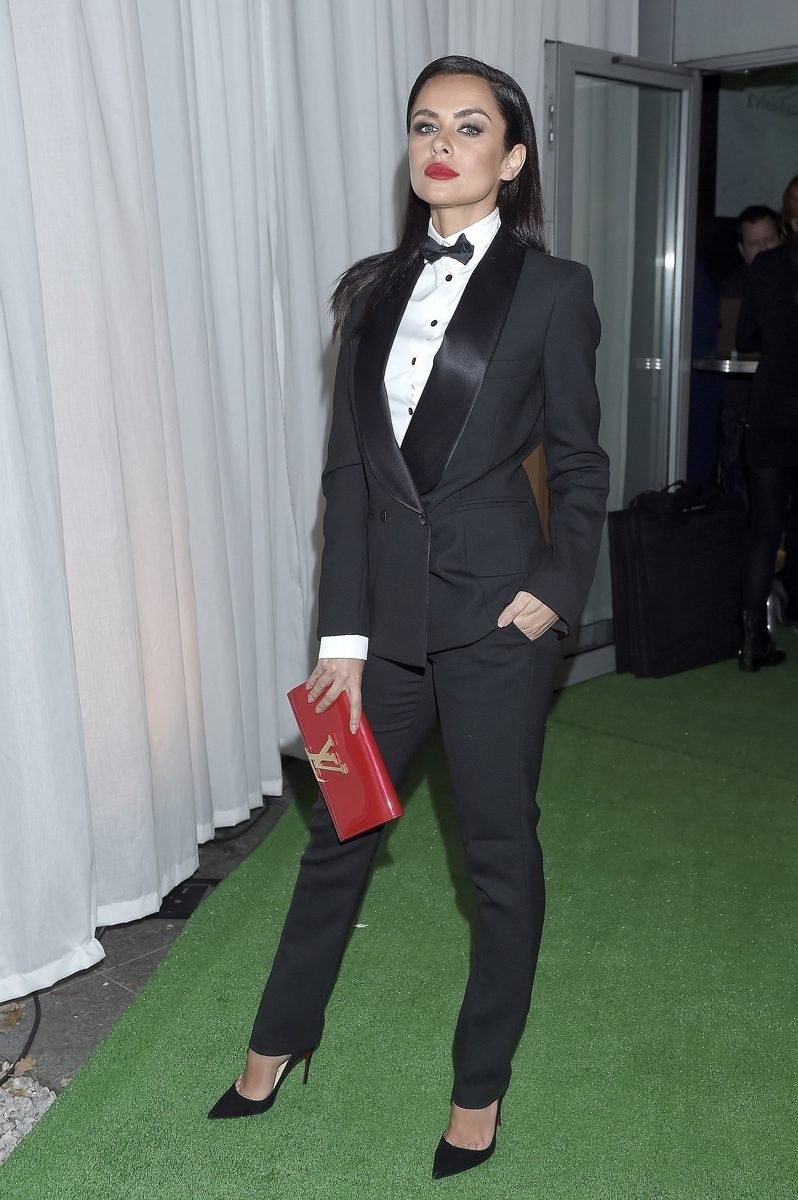 Black Tuxedo Suit with a Bow Tie and a Red Clutch