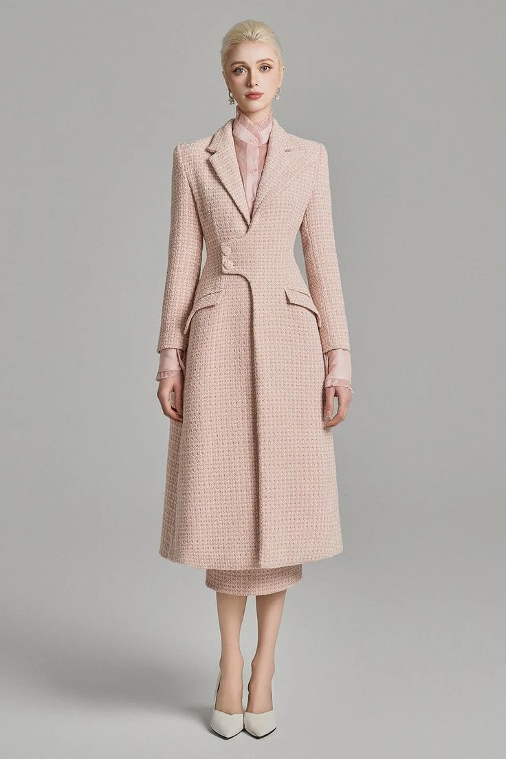 Pale pink coat and dress outfit with low-heeled pumps and a delicate gold necklace