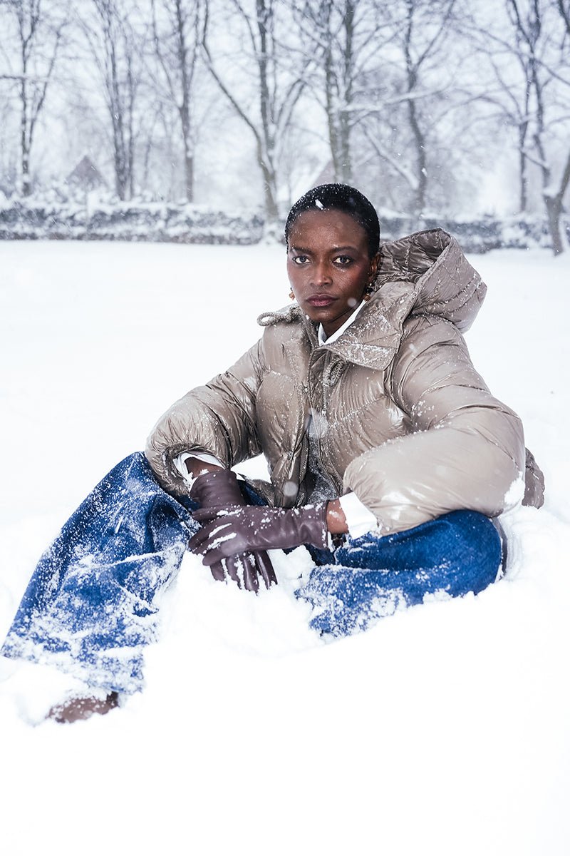 White Puffer, Brown Leather Gloves and Blue Jeans