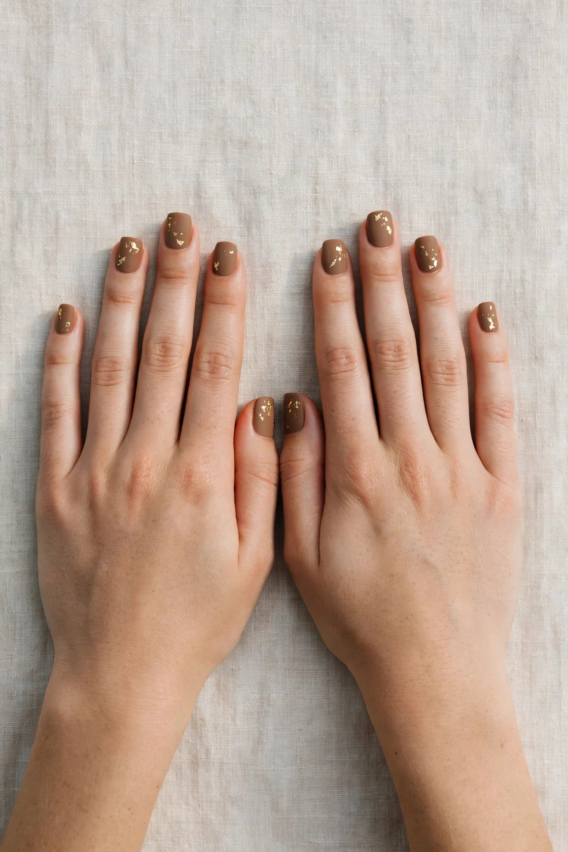 30 Brown Neutral Christmas Nails For Women In Their 20S With Short Square Nails That Are Chic, Warm and Elegant 3 Brown Neutral Christmas Nails with a soft matte finish and gold foil accents