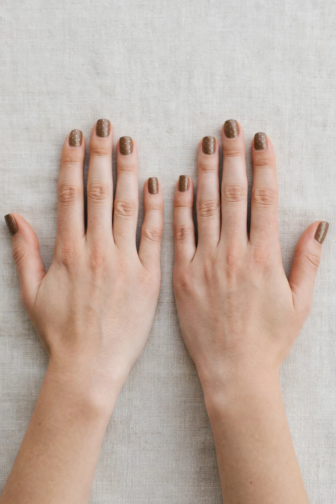 30 Brown Neutral Christmas Nails For Women In Their 20S With Short Square Nails That Are Chic, Warm and Elegant 22 Brown Neutral Christmas Nails with a satin finish and tiny gold dots