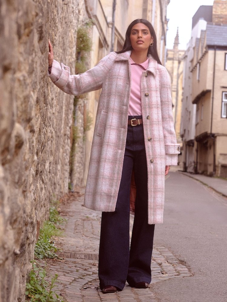 Checked Wool Coat Over a Pink Jumper and Jeans