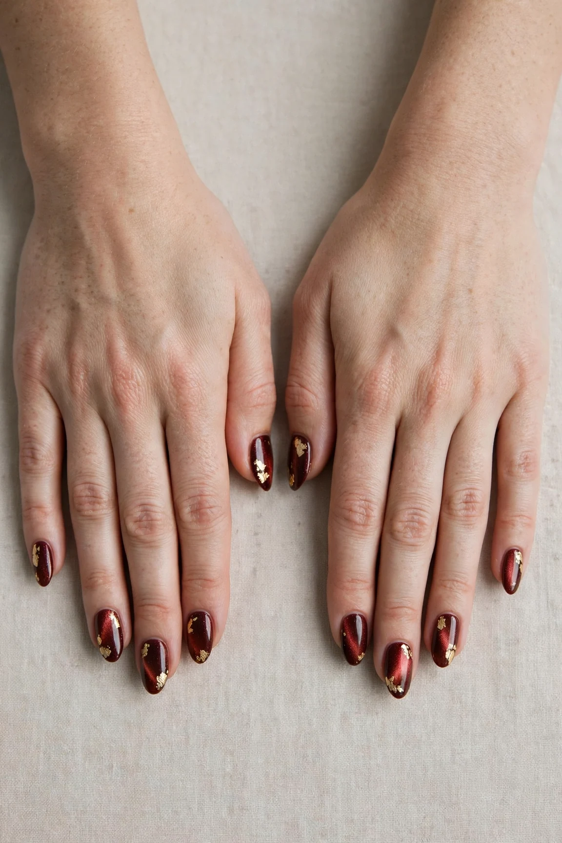 20 Cherry Cola Glossy Nails For Deep Winter Evenings That Are Chic, Warm and Elegant 9 Almond Cherry Cola Glossy Nails with a pearl shimmer finish and gold foil accents
