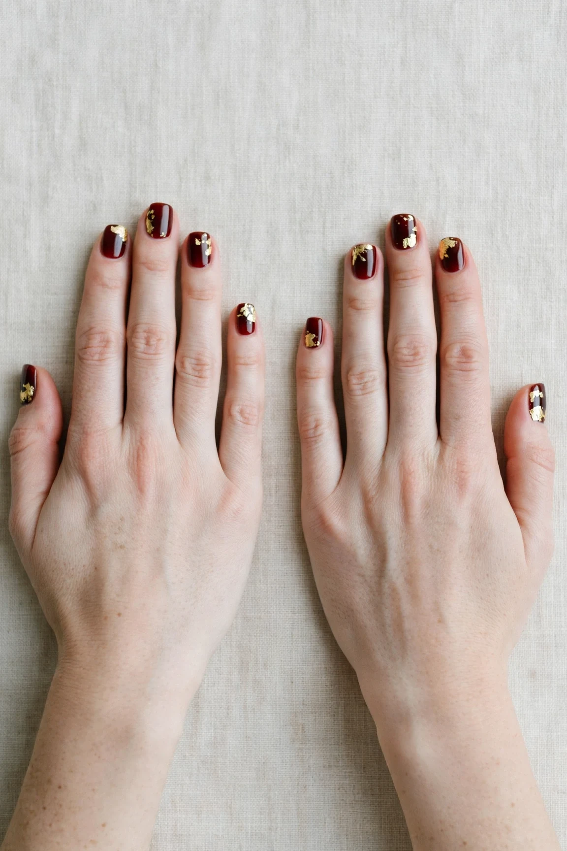 20 Cherry Cola Glossy Nails For Deep Winter Evenings That Are Chic, Warm and Elegant 11 Short Square Cherry Cola Glossy Nails with a glassy gel finish and gold foil accents