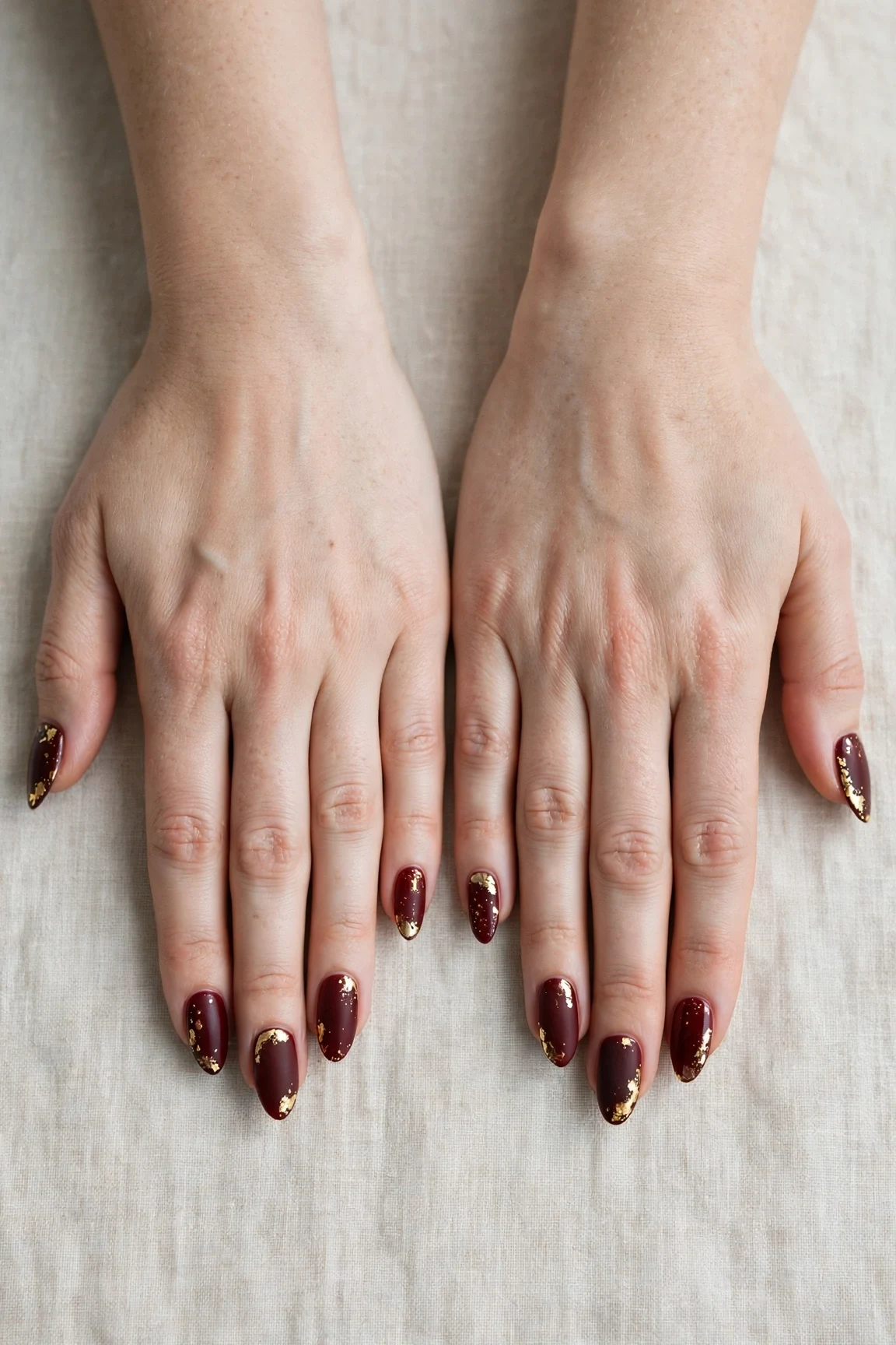 25 Cherry Cola Nail Designs With Gold Accents For Winter Weddings That Are Chic, Warm and Elegant 3 Almond Cherry Cola Nail Designs with Gold Accents with a soft matte finish and gold foil accents