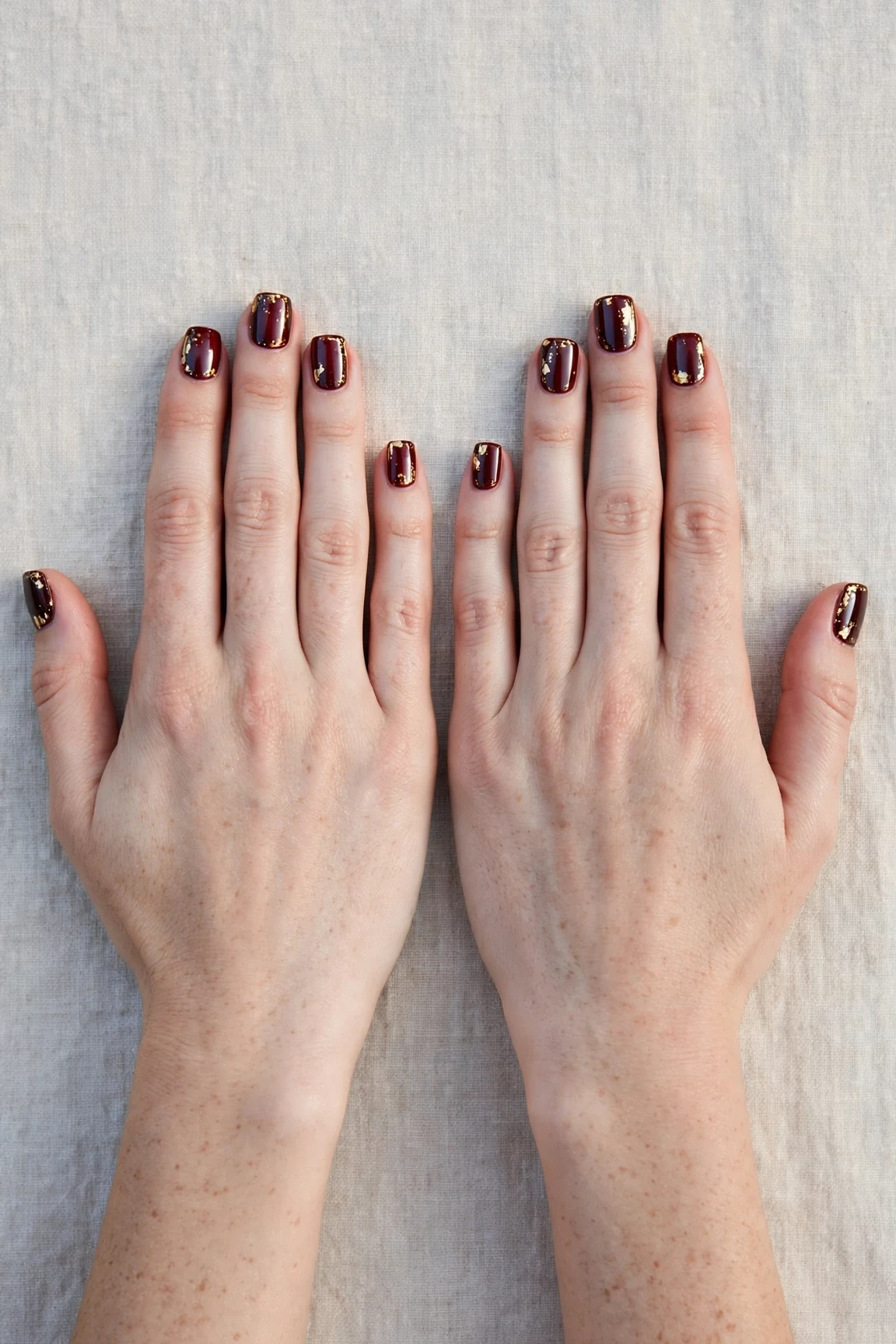 25 Cherry Cola Nail Designs With Gold Accents For Winter Weddings That Are Chic, Warm and Elegant 5 Short Square Cherry Cola Nail Designs with Gold Accents with a chrome shine and gold foil accents
