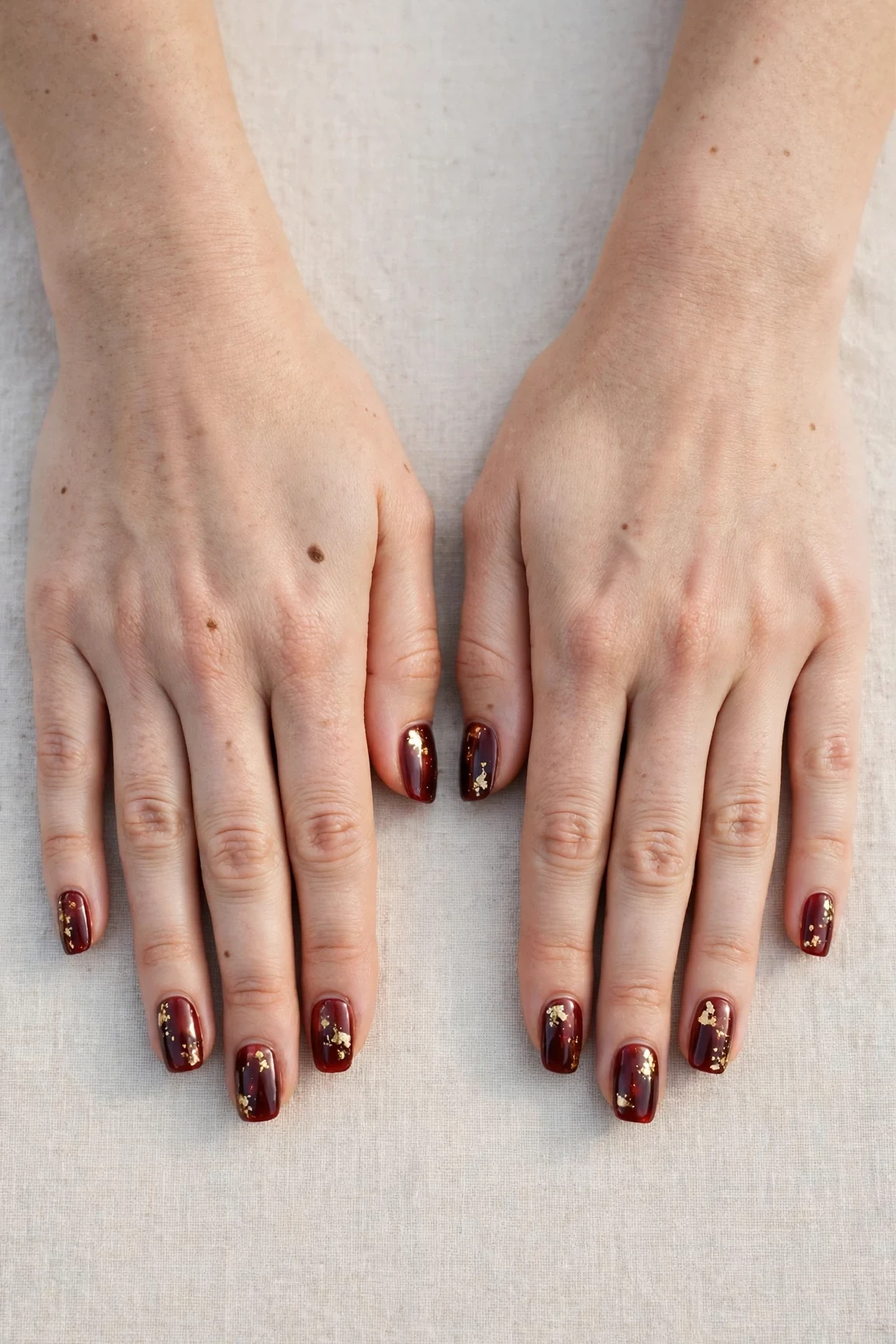 25 Cherry Cola Nail Designs With Gold Accents For Winter Weddings That Are Chic, Warm and Elegant 6 Squoval Cherry Cola Nail Designs with Gold Accents with a sheer jelly finish and gold foil accents