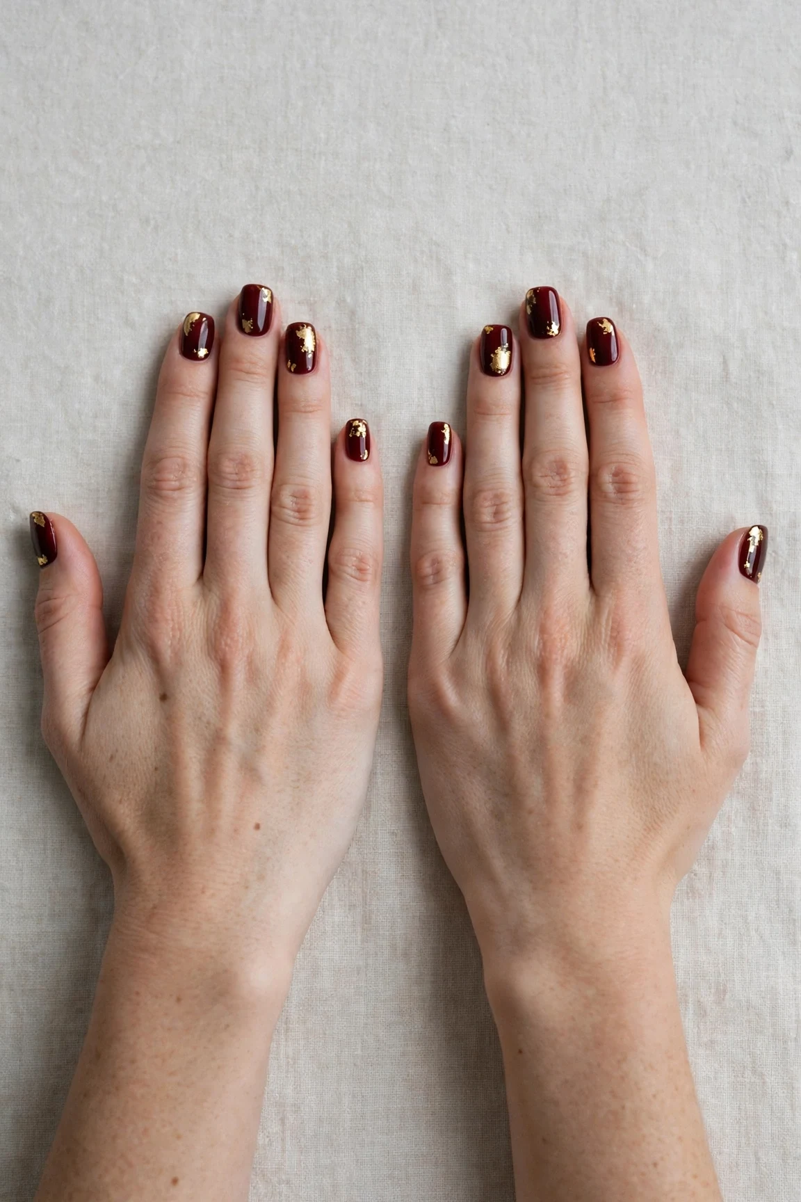 25 Cherry Cola Nail Designs With Gold Accents For Winter Weddings That Are Chic, Warm and Elegant 11 Short Square Cherry Cola Nail Designs with Gold Accents with a glassy gel finish and gold foil accents