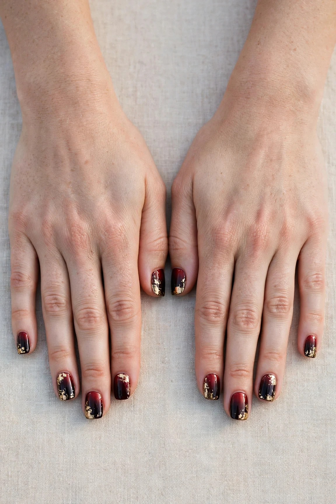 Short Square Cherry Cola Ombre Nails with a chrome shine and gold foil accents