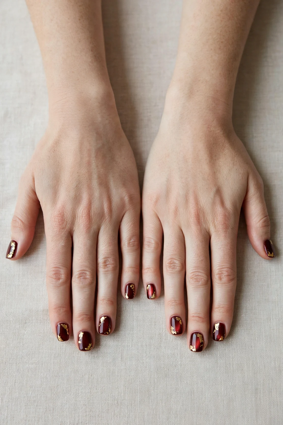 38 Cherry Cola Short Square Nails For January Office Wear That Are Chic, Warm and Elegant 9 Cherry Cola Short Square Nails with a pearl shimmer finish and gold foil accents