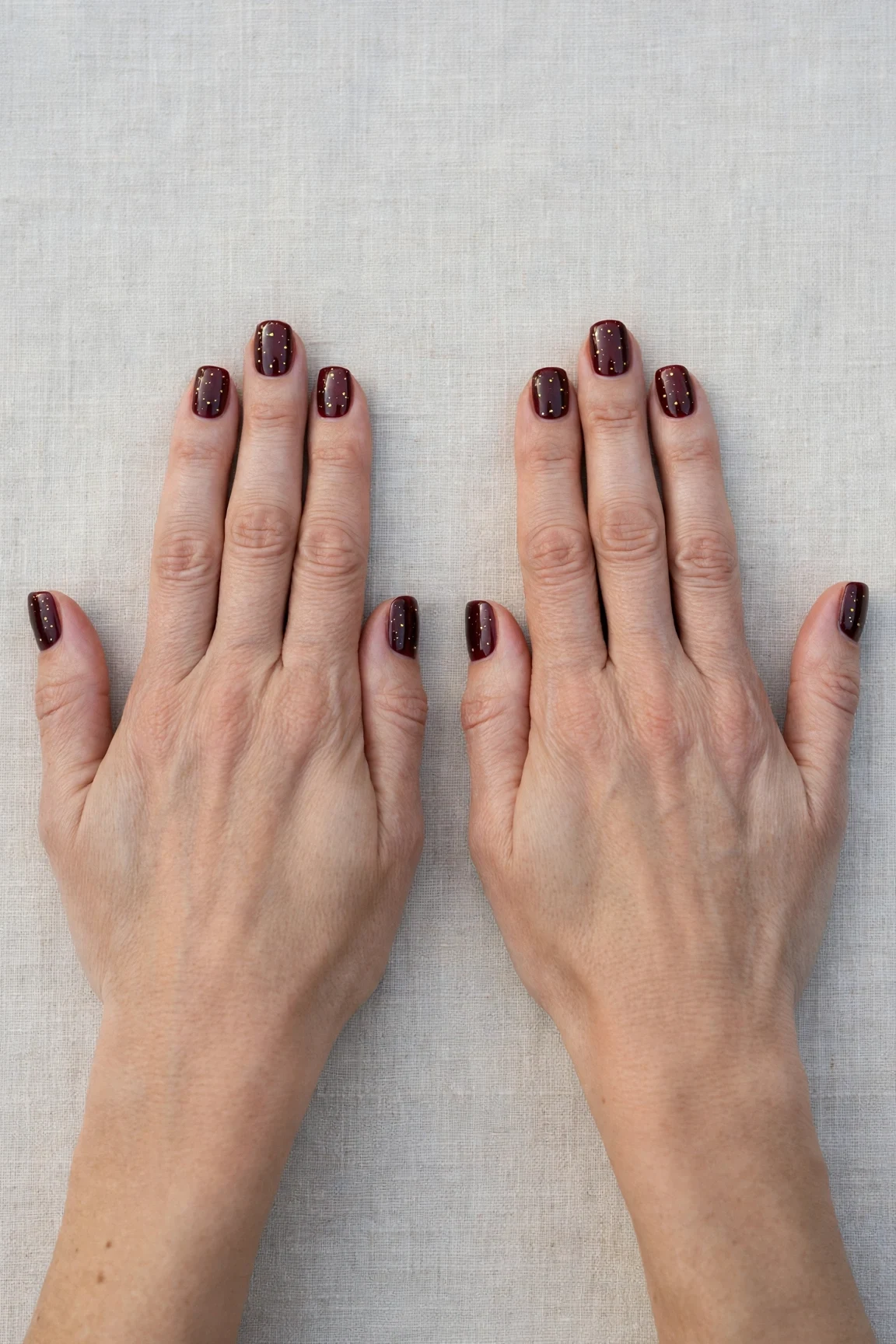 38 Cherry Cola Short Square Nails For January Office Wear That Are Chic, Warm and Elegant 25 Cherry Cola Short Square Nails with a deep glossy shine and tiny gold dots