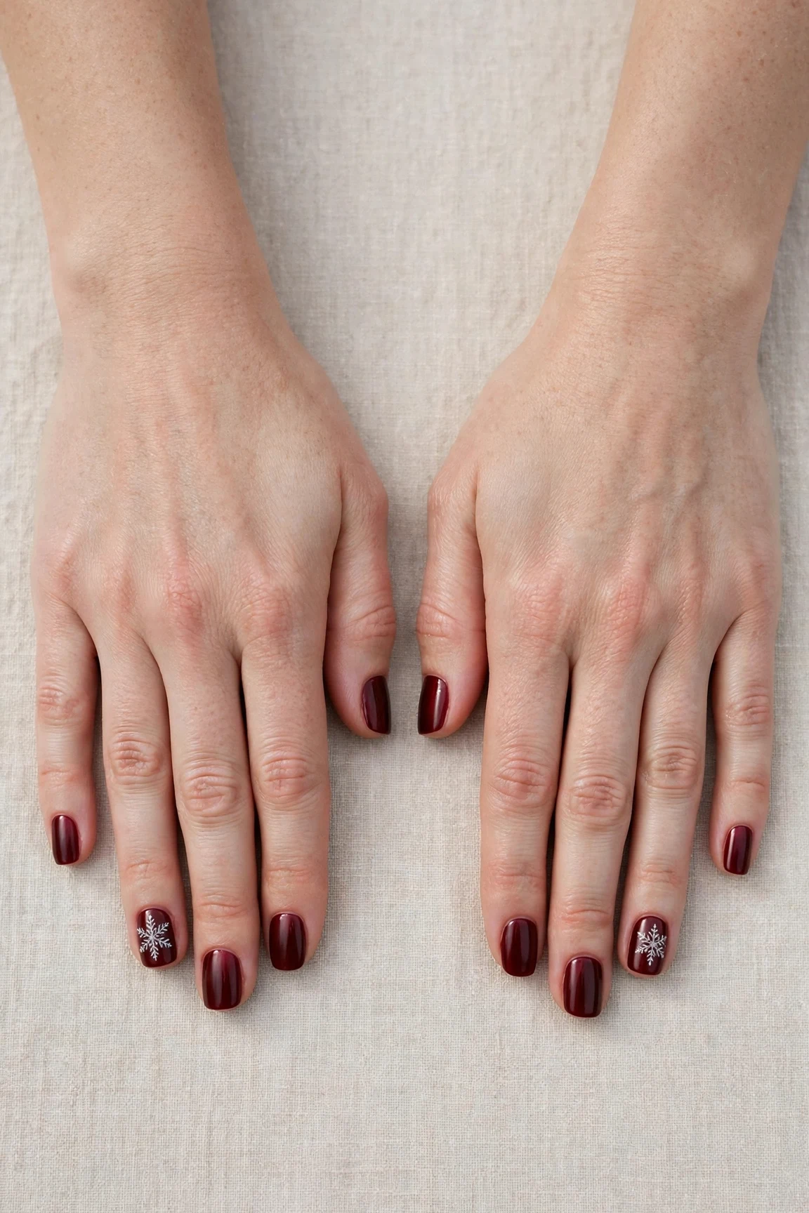 38 Cherry Cola Short Square Nails For January Office Wear That Are Chic, Warm and Elegant 34 Cherry Cola Short Square Nails with a satin finish and a delicate snowflake on the ring finger