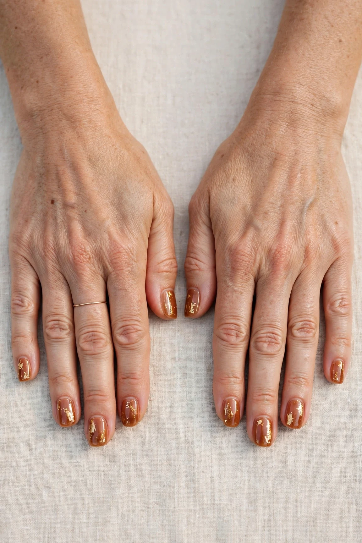 22 Cinnamon Spice Matte Nails For Women Over 40 For January Parties That Are Chic, Warm and Elegant 6 Squoval Cinnamon Spice Matte Nails with a sheer jelly finish and gold foil accents