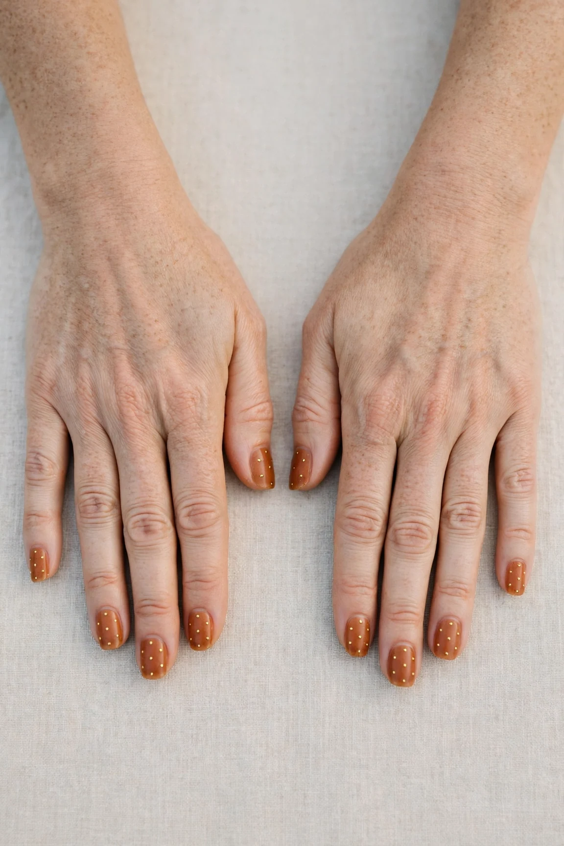 22 Cinnamon Spice Matte Nails For Women Over 40 For January Parties That Are Chic, Warm and Elegant 18 Squoval Cinnamon Spice Matte Nails with a sheer jelly finish and tiny gold dots