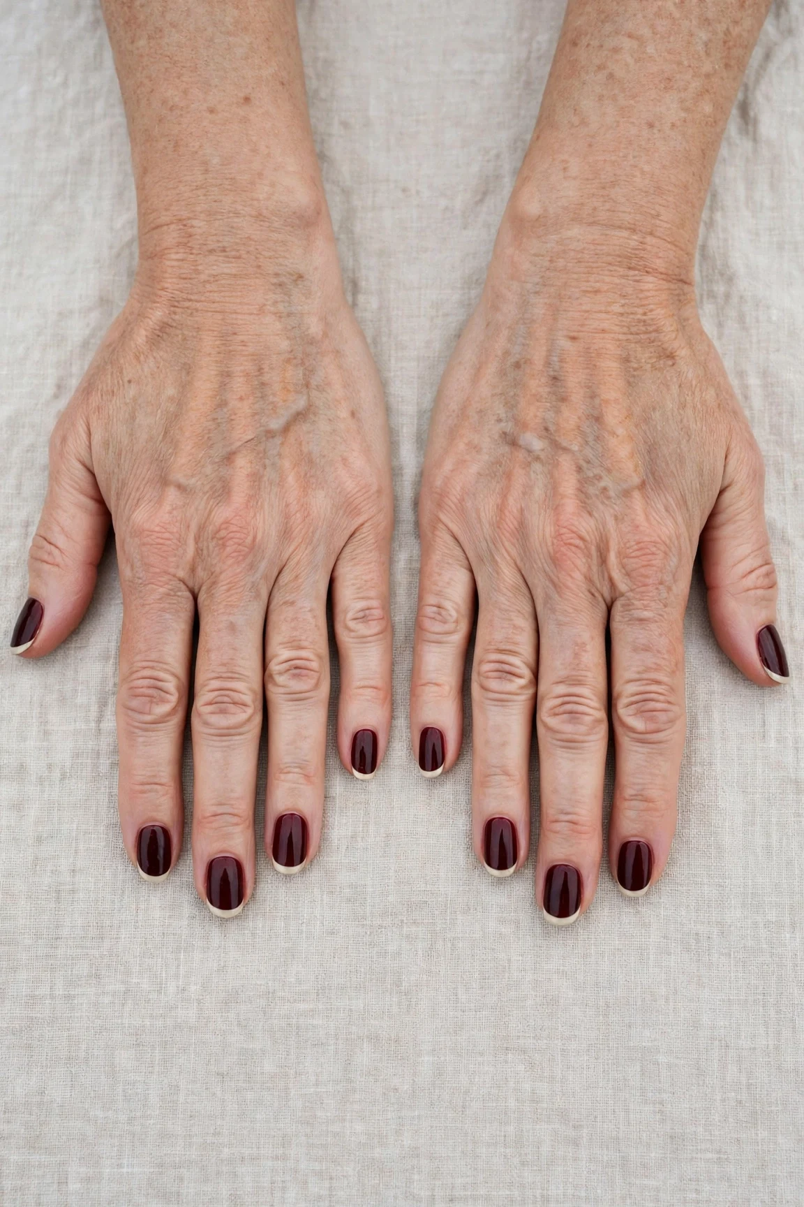 Dark Cherry Velvet French Tip Nails with a high-gloss finish and classic cream French tips
