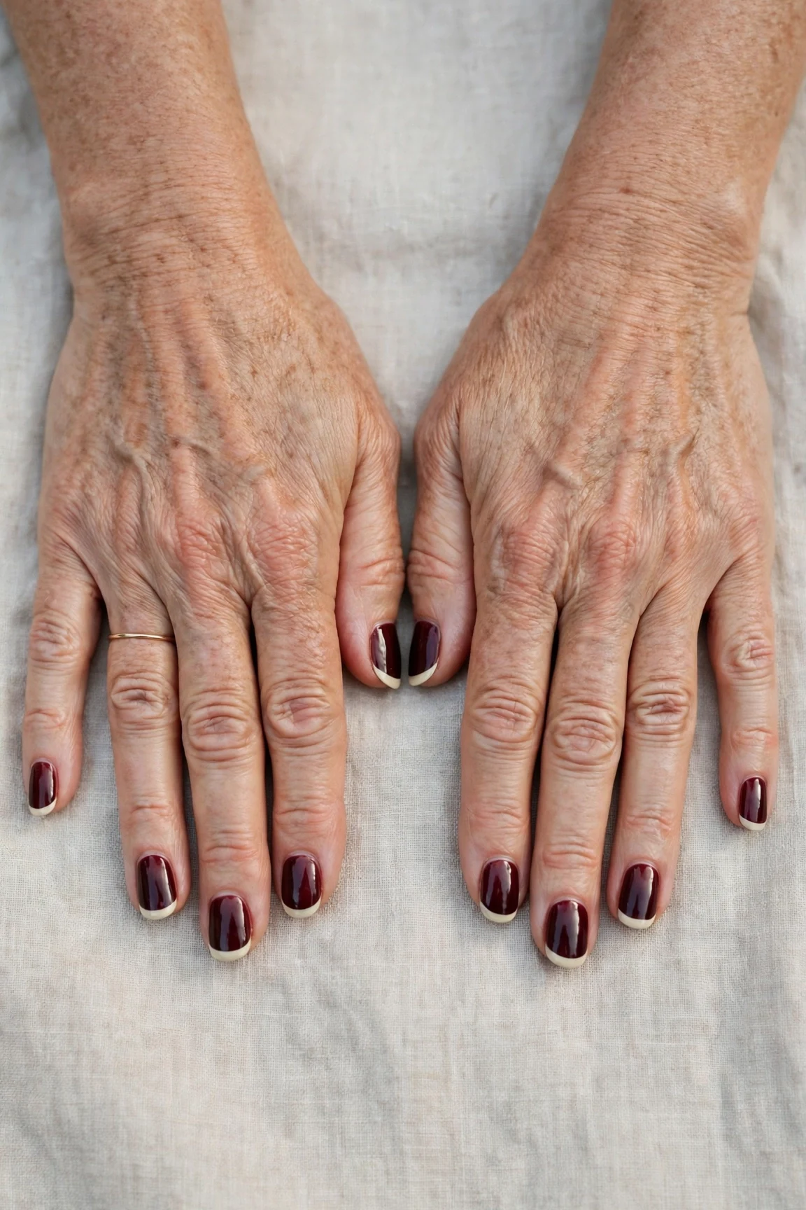 Dark Cherry Velvet French Tip Nails with a sheer jelly finish and classic cream French tips
