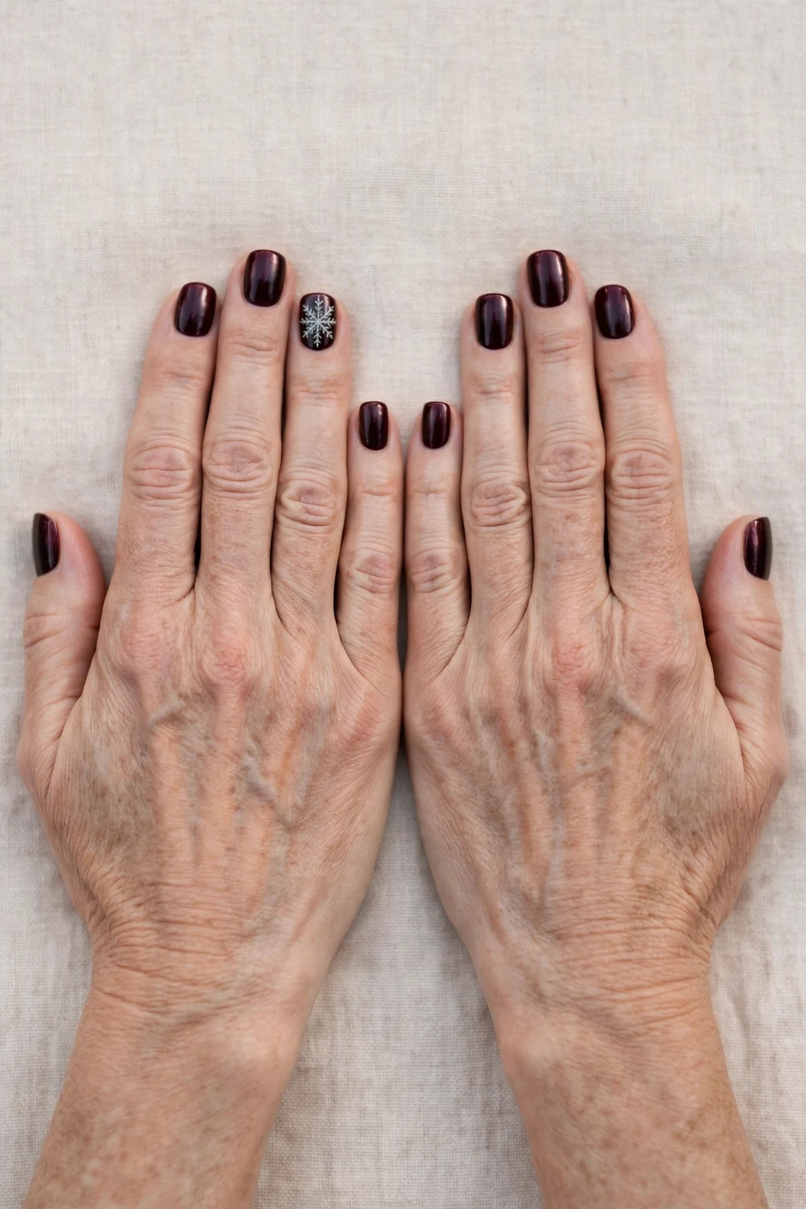 Short Square Dark Cherry Velvet Manicure Ideas with a chrome shine and a delicate snowflake on the ring finger