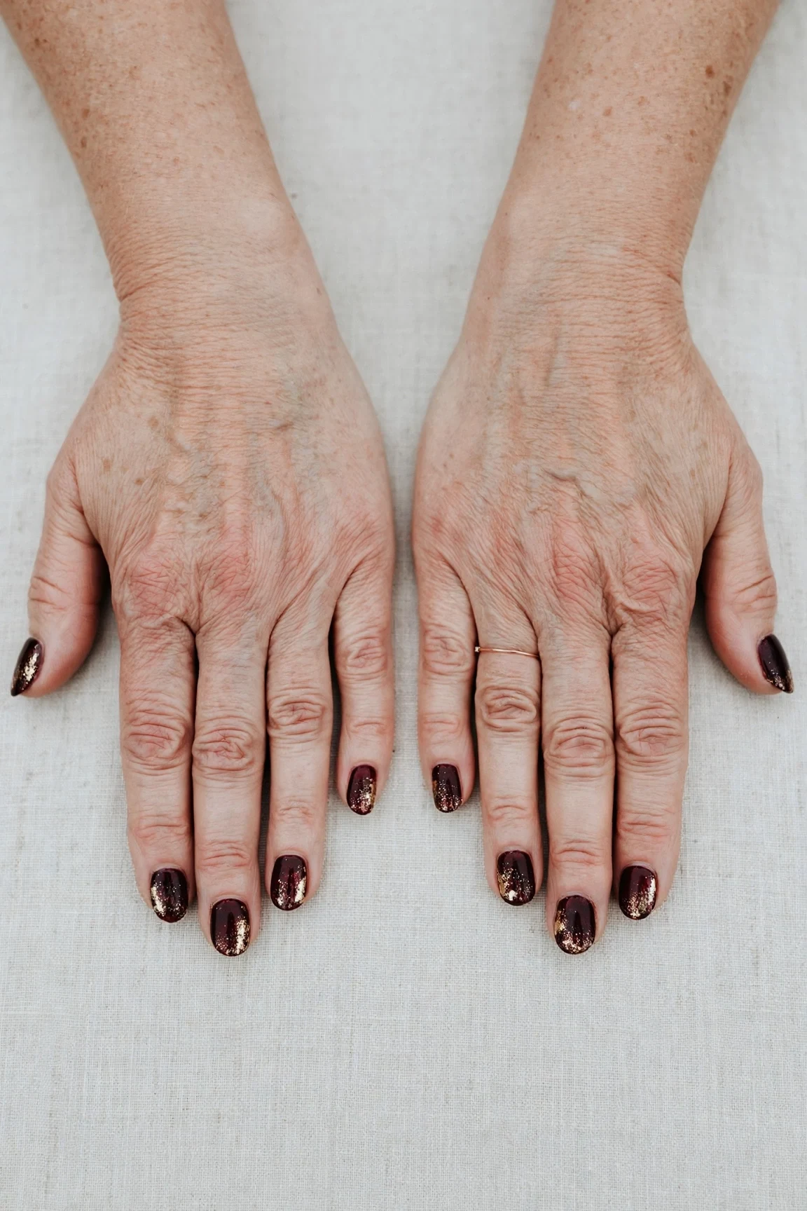 Dark Cherry Velvet Short Nails with a glitter gradient finish and gold foil accents