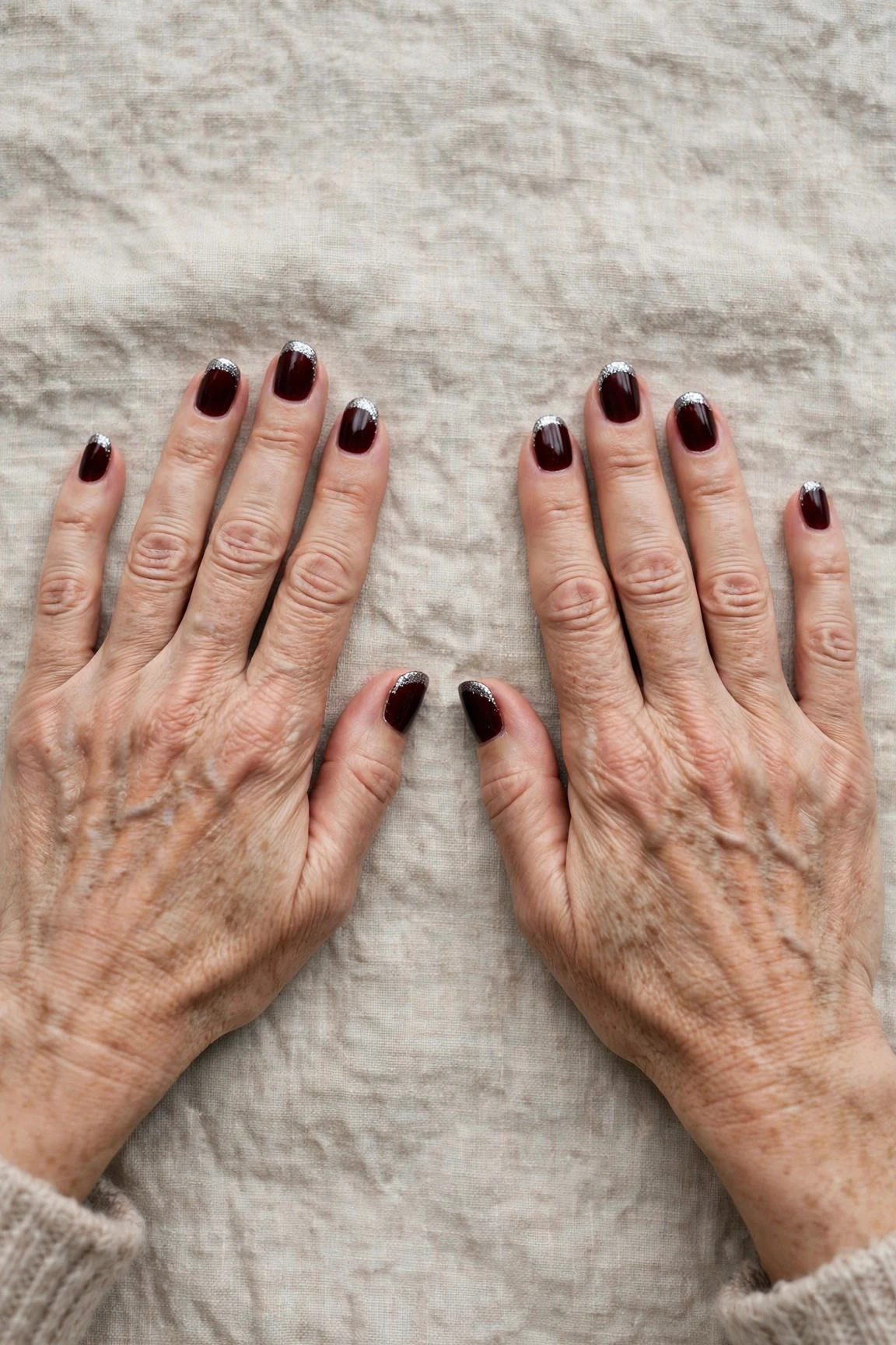 Dark Cherry Velvet Short Nails with a high-gloss finish and silver shimmer tips