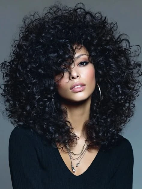 Deep Side Part Curls with a Relaxed, Defined Finish