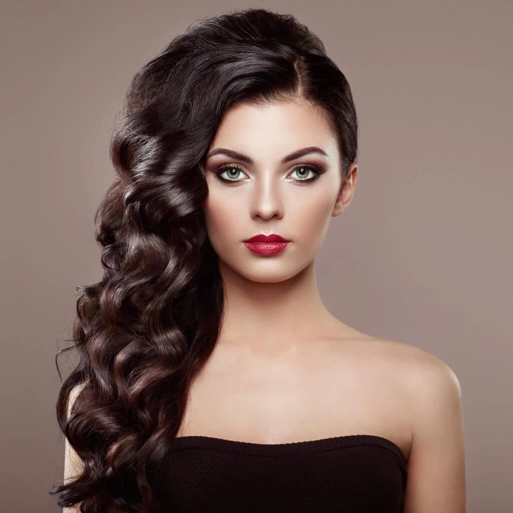 Voluminous Curly Hair with a Deep Side Part and Soft Ends