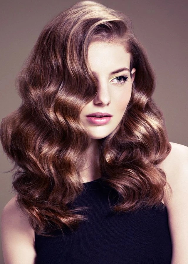 Long Hair with Soft Waves and a Deep Side Sweep for Evenings