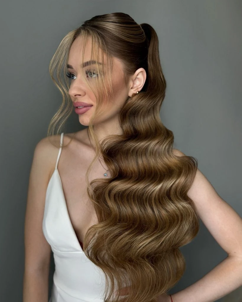 Deep Side Part Long Hair with Soft Waves and a Side Sweep