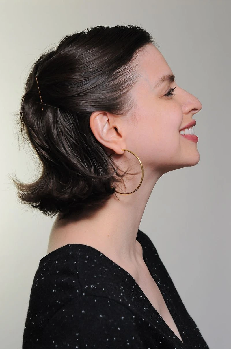 Elegant Short Hair with a Deep Side Part and a Polished Tuck with a Deep Sweep Finish