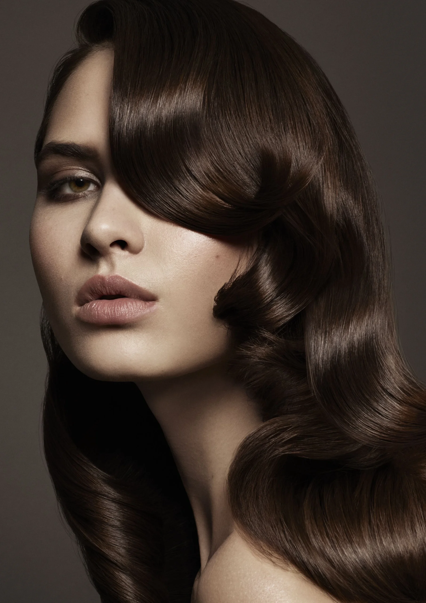 Voluminous Wavy Hair with a Deep Side Part for Evenings