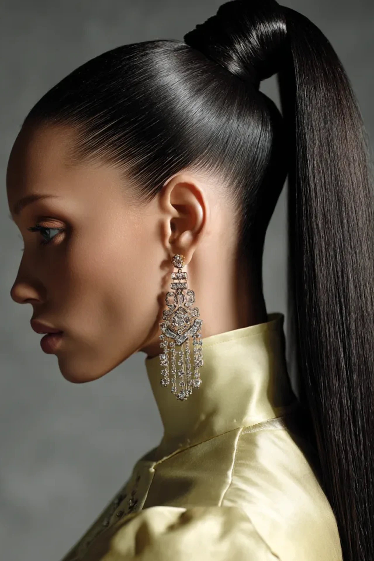 Refined Long Slick Ponytail with Statement Earrings
