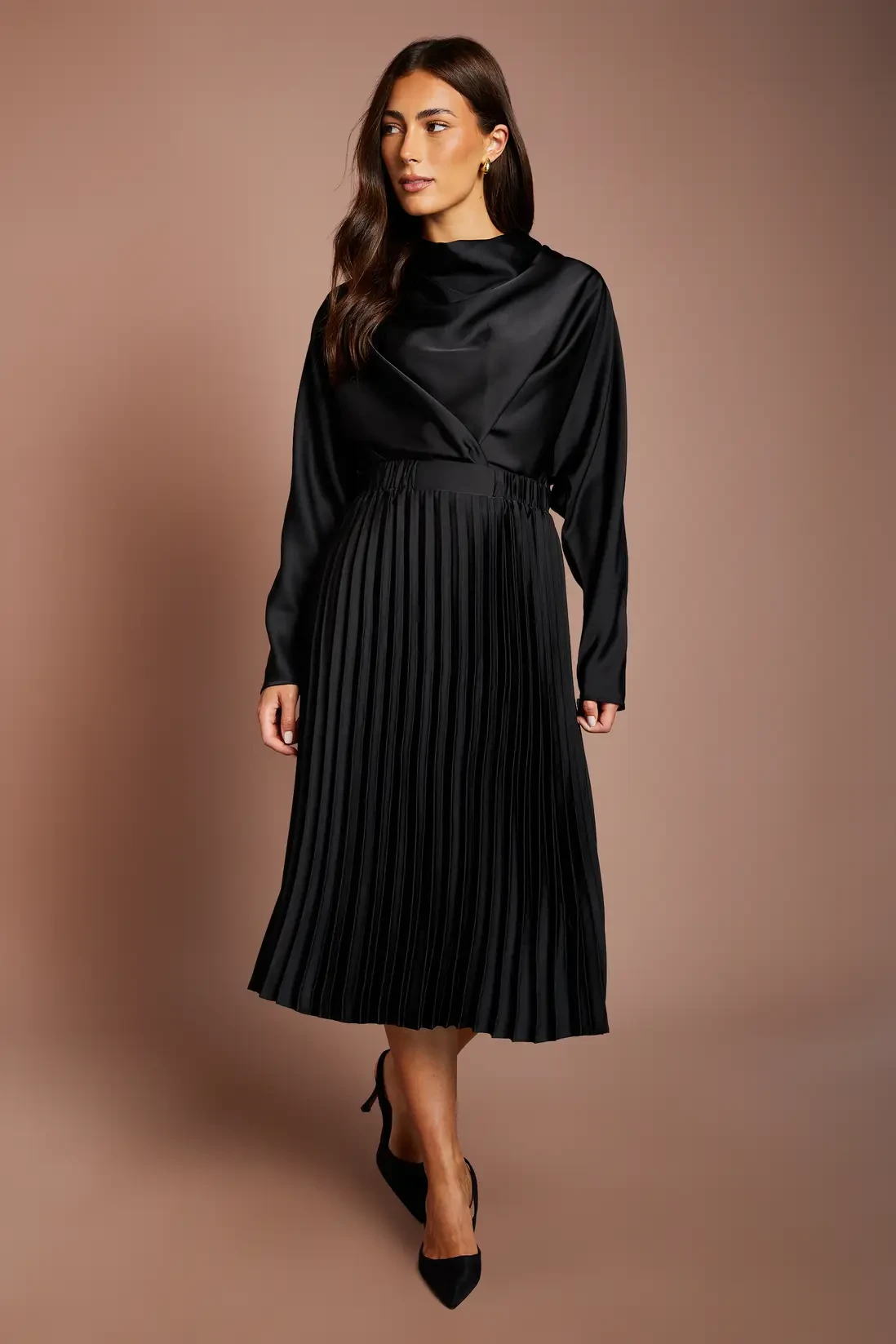 Black Satin Pleated Skirt with gold hoop earrings