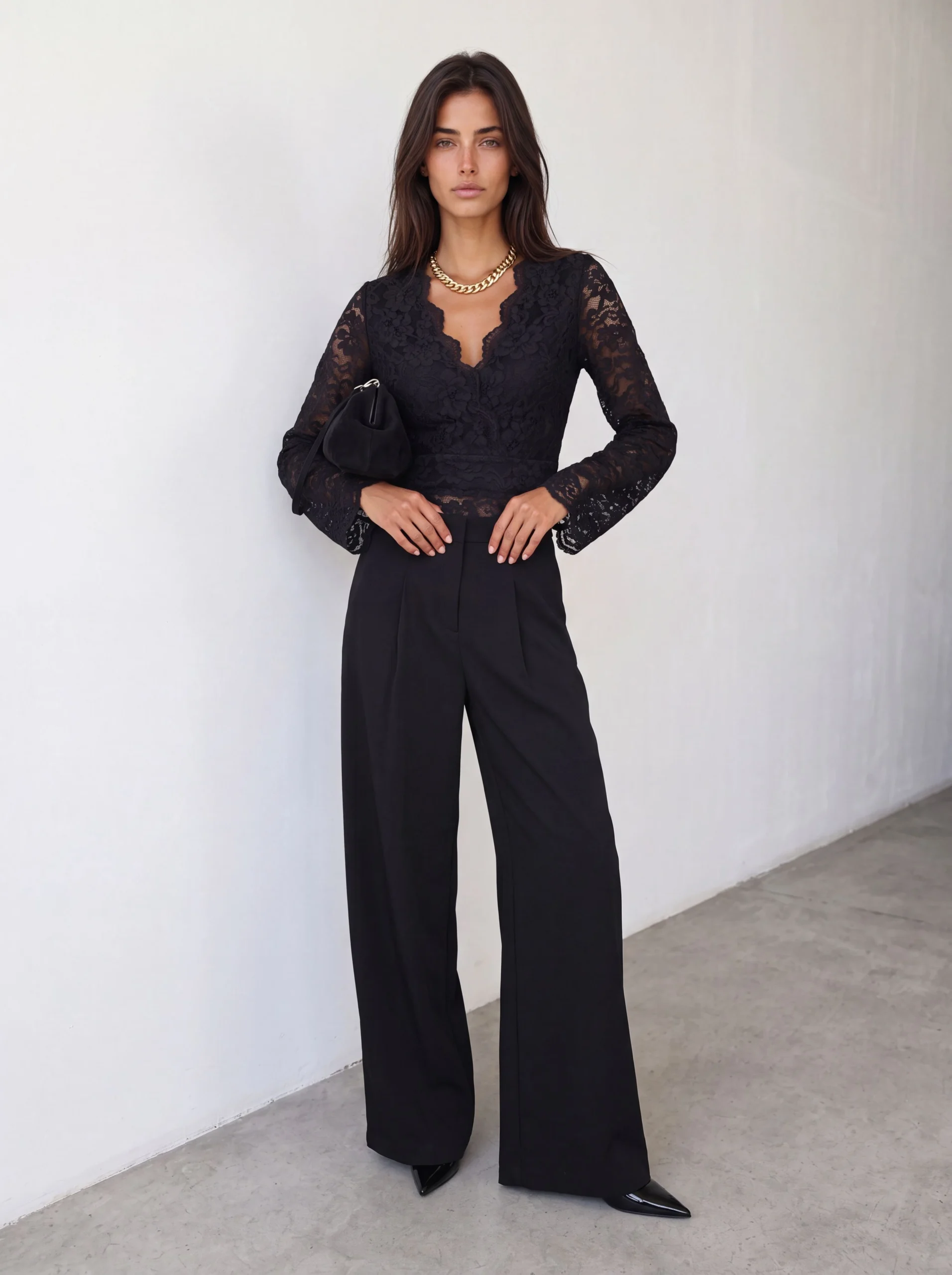Black Lace Blouse and Trousers with a gold pendant necklace