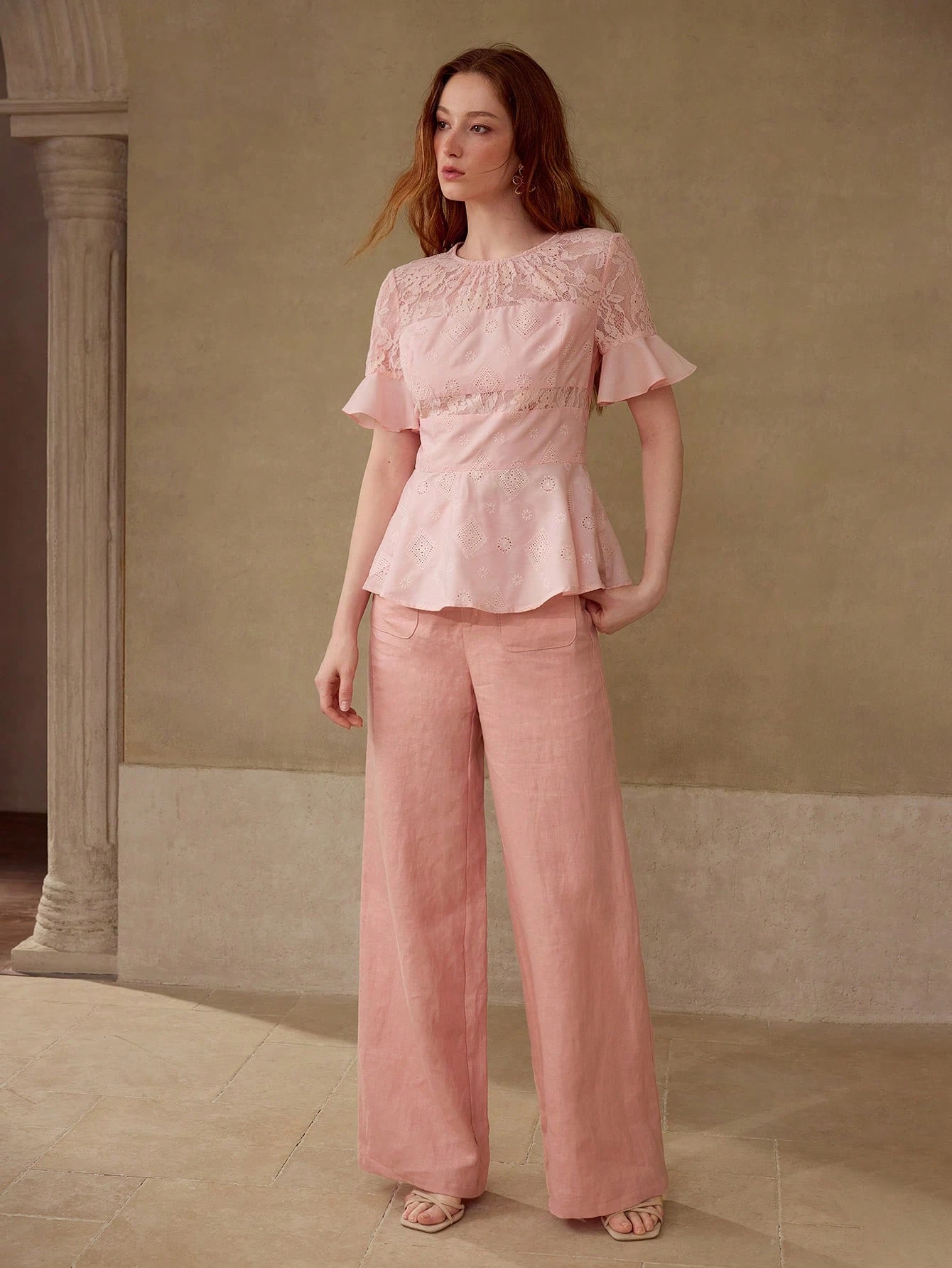 Blush Lace Peplum Blouse and Trousers with a delicate gold bracelet
