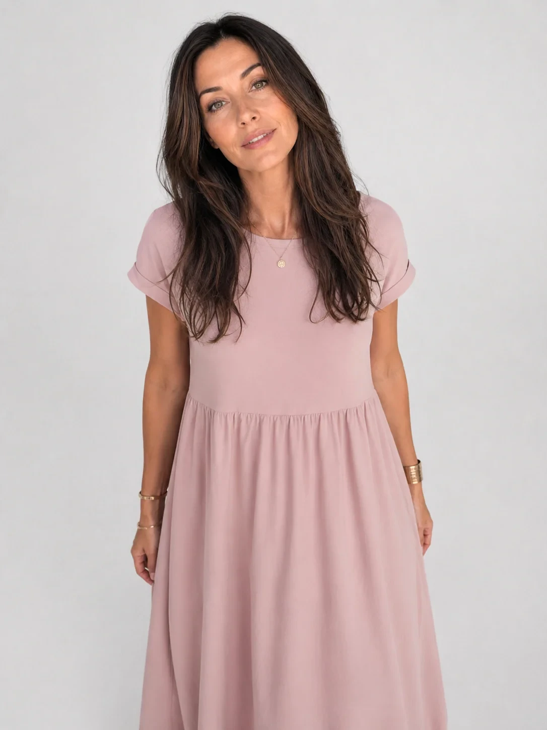 Dusty Pink Tea-Length Dress with a delicate gold bracelet