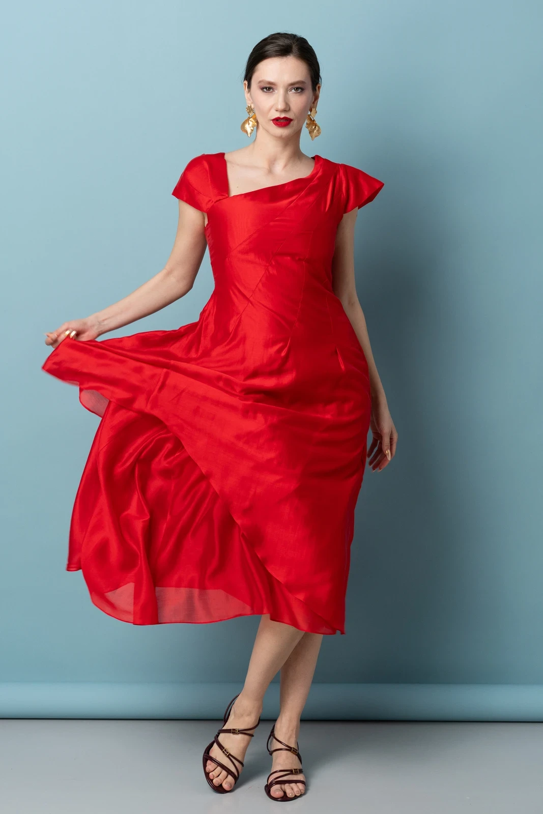 Red Tea-Length Dress with gold hoop earrings