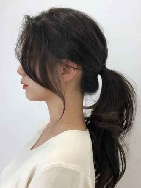30 Hat Proof Low Ponytail Hairstyles for Winter Walks - Idea 8