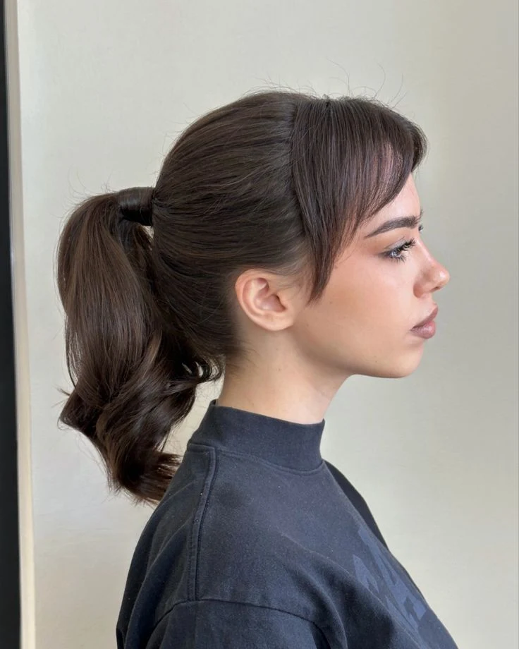 30 Hat Proof Low Ponytail Hairstyles for Winter Walks - Idea 25