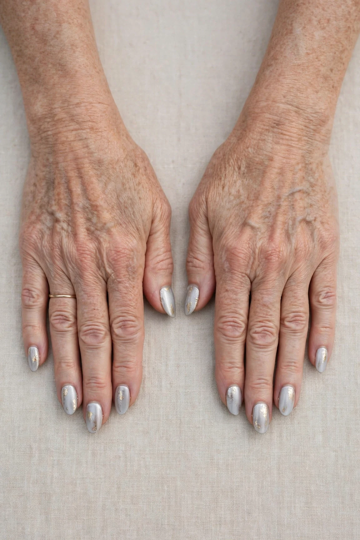 Almond Icy Silver Frosted Chrome Nails with a soft matte finish and gold foil accents