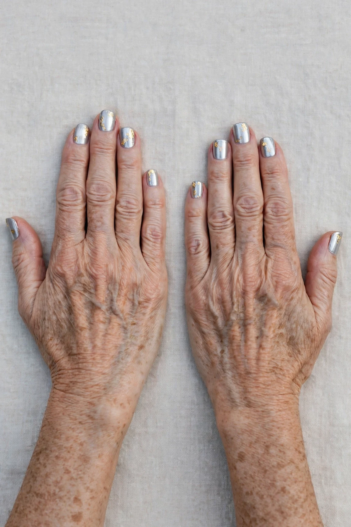 Short Square Icy Silver Frosted Chrome Nails with a glassy gel finish and gold foil accents