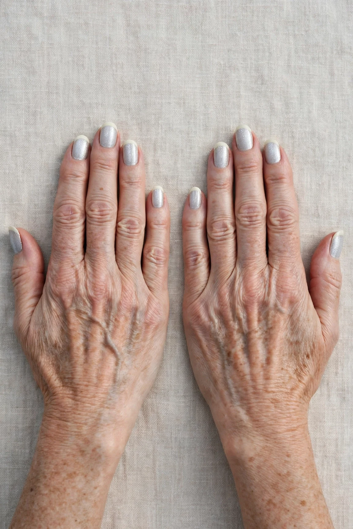 50 Icy Silver Frosted French Nails For Women Over 60 For New Year Celebrations That Are Chic, Warm and Elegant 9 Icy Silver Frosted French Nails with a pearl shimmer finish and classic cream French tips