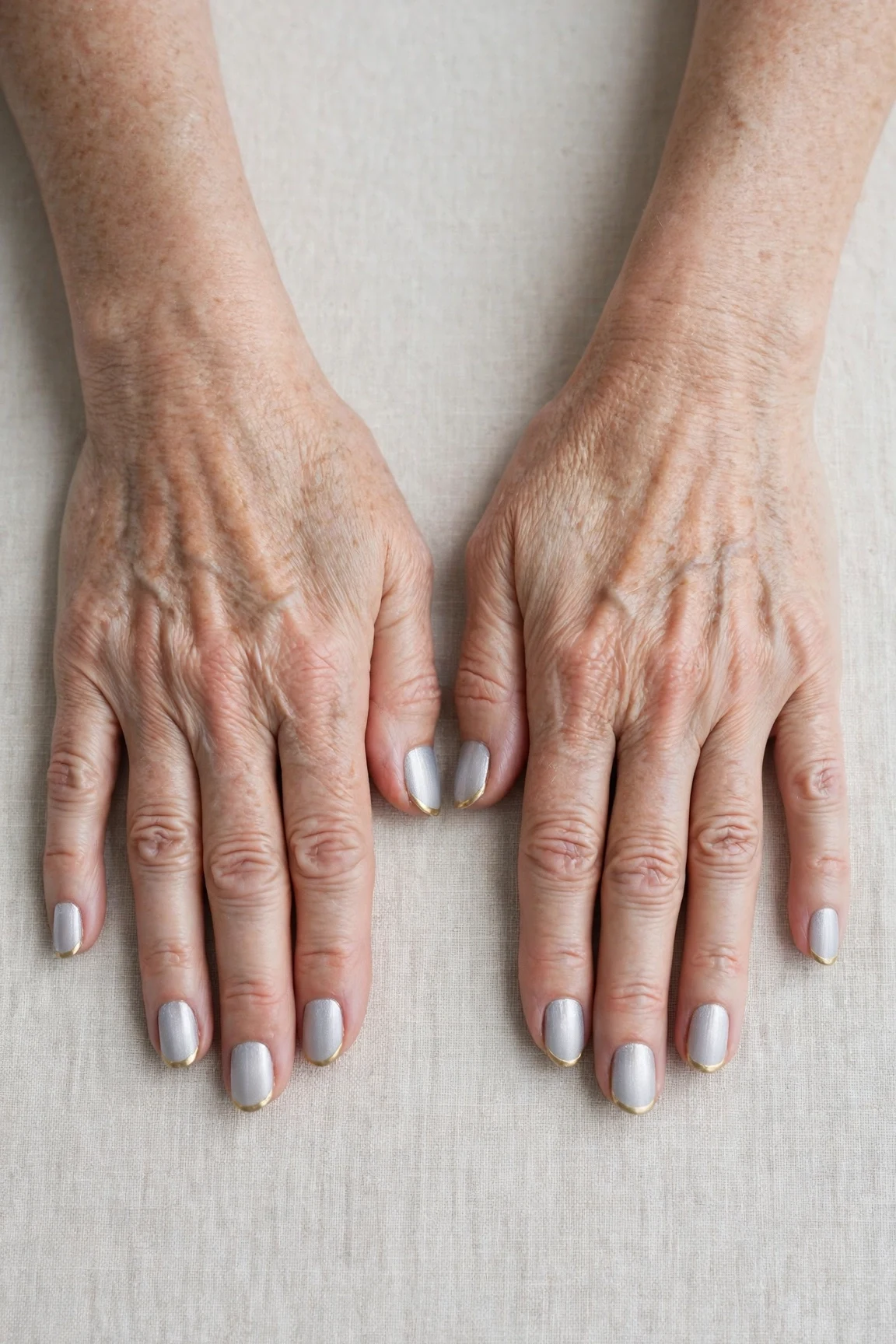 50 Icy Silver Frosted French Nails For Women Over 60 For New Year Celebrations That Are Chic, Warm and Elegant 24 Icy Silver Frosted French Nails with a creamy opaque finish and gold French tips