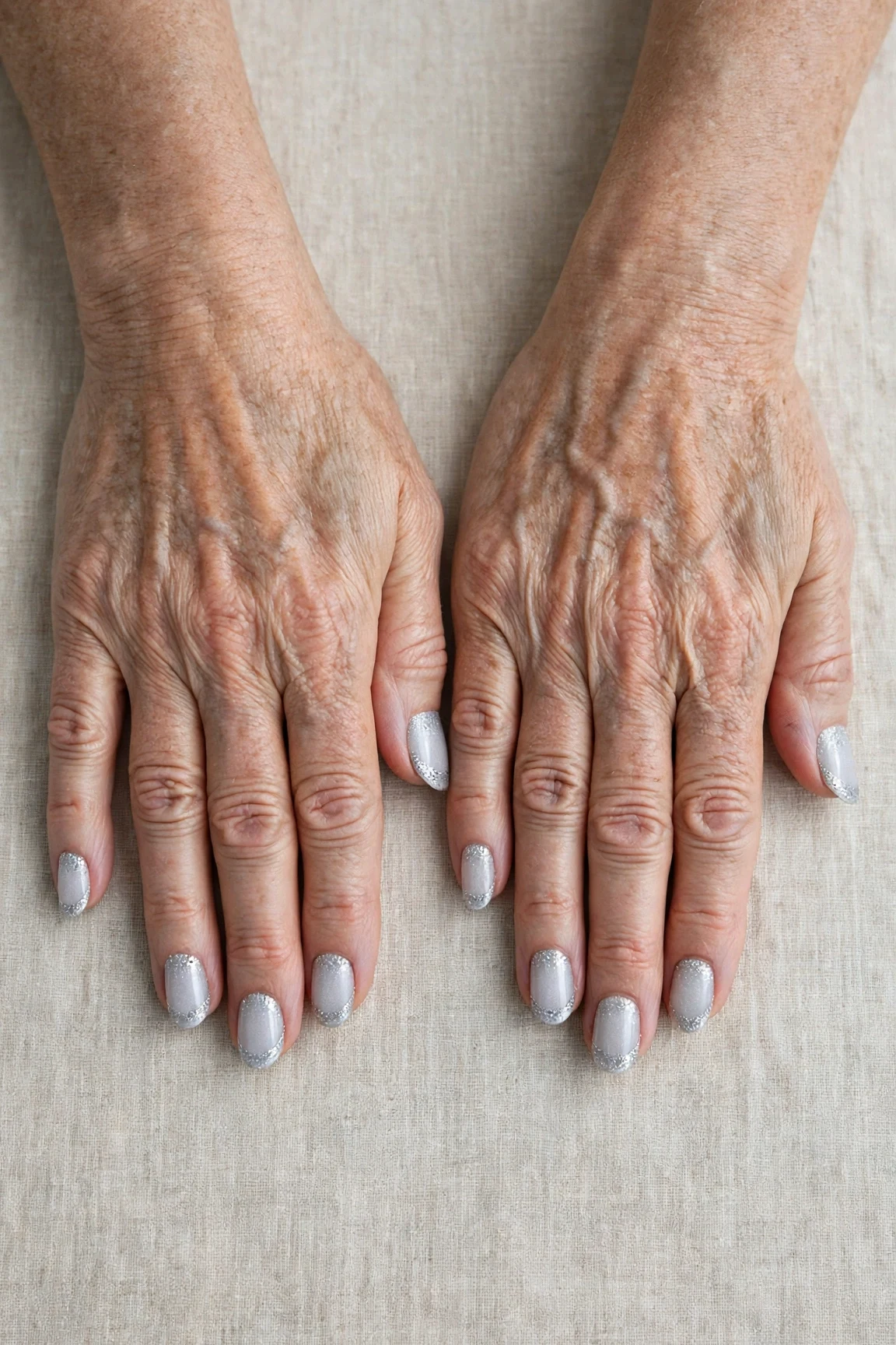 50 Icy Silver Frosted French Nails For Women Over 60 For New Year Celebrations That Are Chic, Warm and Elegant 26 Icy Silver Frosted French Nails with a high-gloss finish and glitter French tips