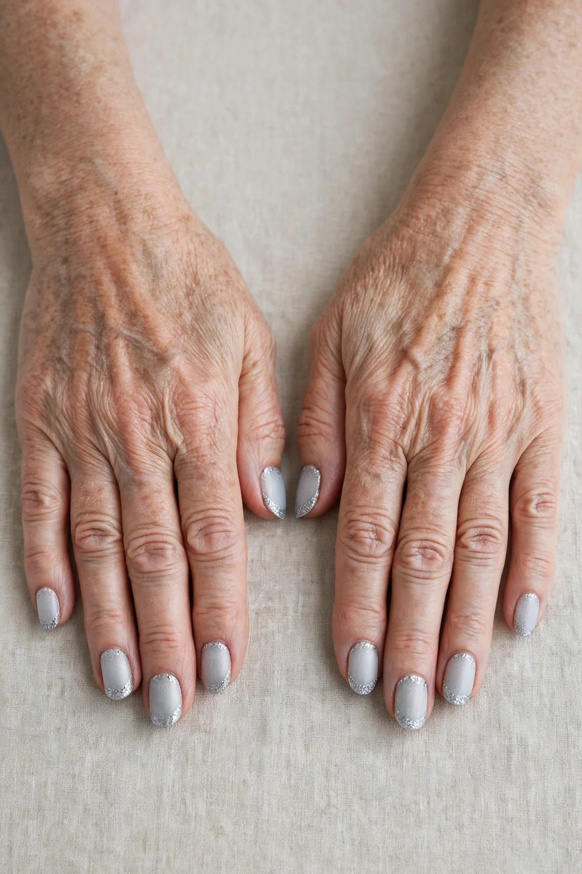 50 Icy Silver Frosted French Nails For Women Over 60 For New Year Celebrations That Are Chic, Warm and Elegant 28 Icy Silver Frosted French Nails with a velvet matte finish and glitter French tips