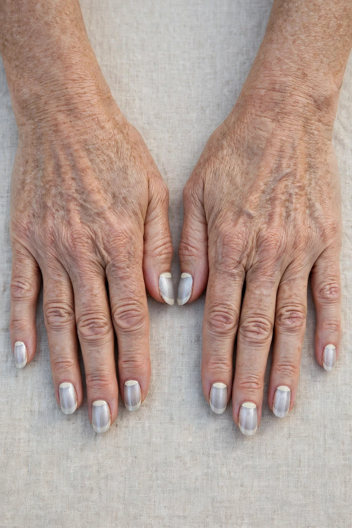 50 Icy Silver Frosted French Nails For Women Over 60 For New Year Celebrations That Are Chic, Warm and Elegant 42 Icy Silver Frosted French Nails with a sheer jelly finish and reverse French tips in cream
