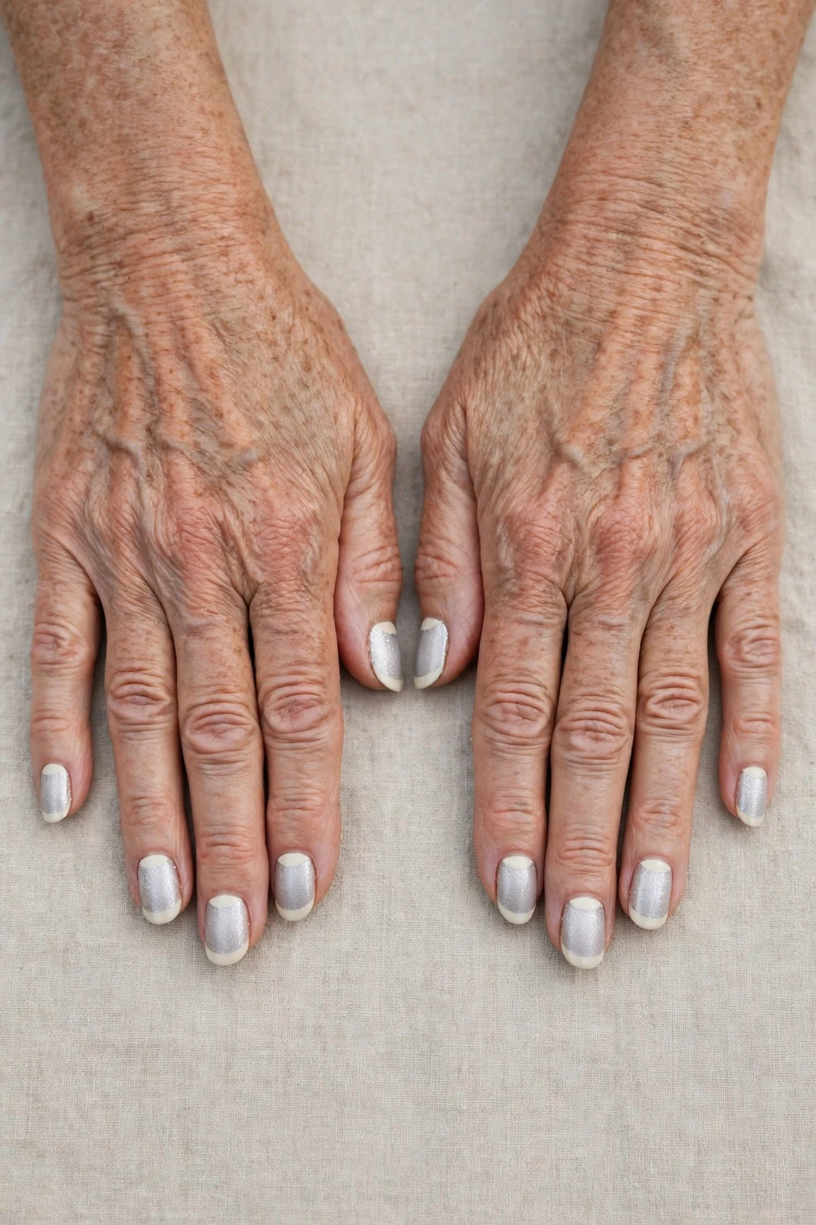 50 Icy Silver Frosted French Nails For Women Over 60 For New Year Celebrations That Are Chic, Warm and Elegant 43 Icy Silver Frosted French Nails with a frosted shimmer finish and reverse French tips in cream