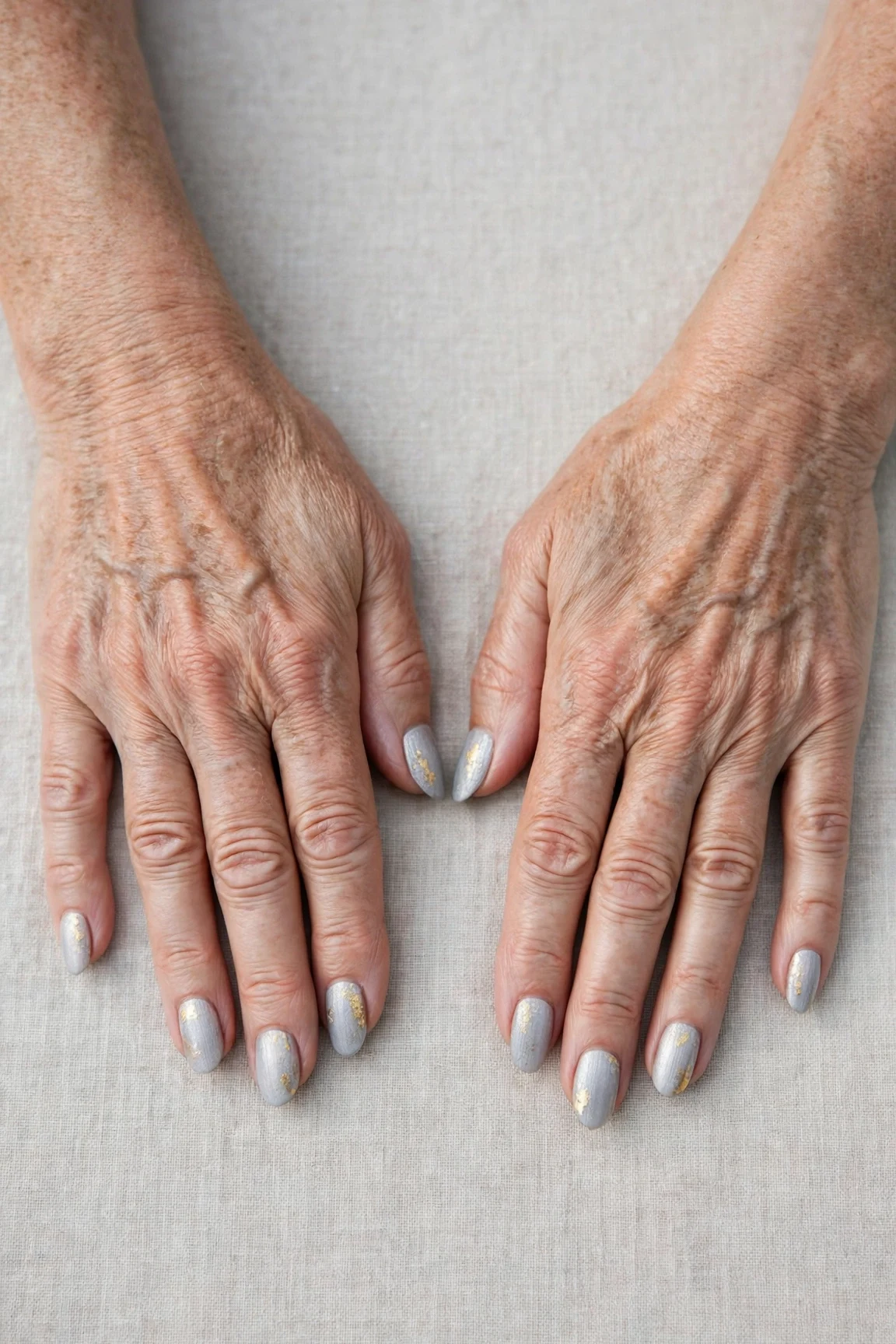 20 Icy Silver Frosted Nail Designs For Women Over 60 For Winter Weddings That Are Chic, Warm and Elegant 3 Almond Icy Silver Frosted Nail Designs with a soft matte finish and gold foil accents