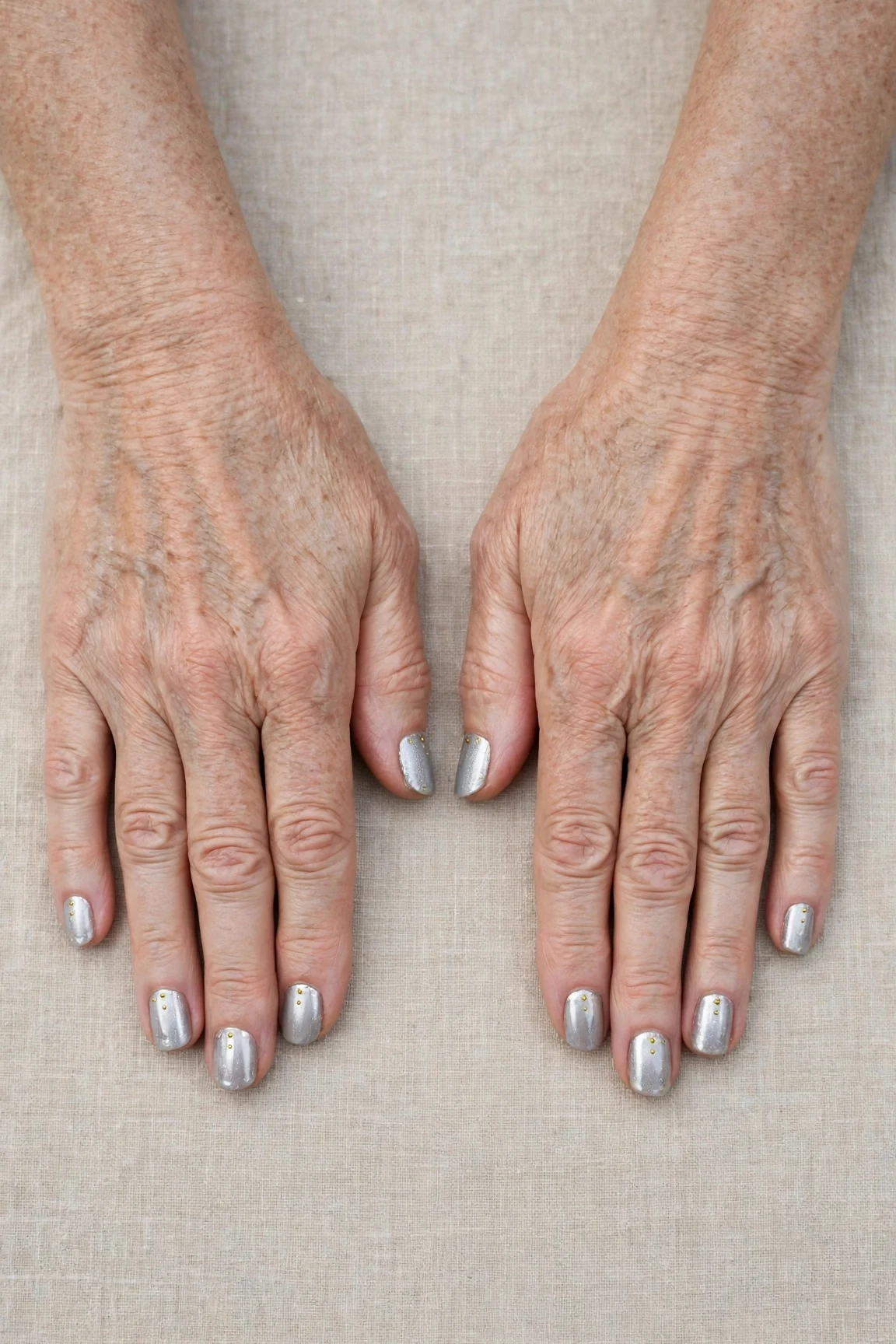 20 Icy Silver Frosted Nail Designs For Women Over 60 For Winter Weddings That Are Chic, Warm and Elegant 17 Short Square Icy Silver Frosted Nail Designs with a chrome shine and tiny gold dots