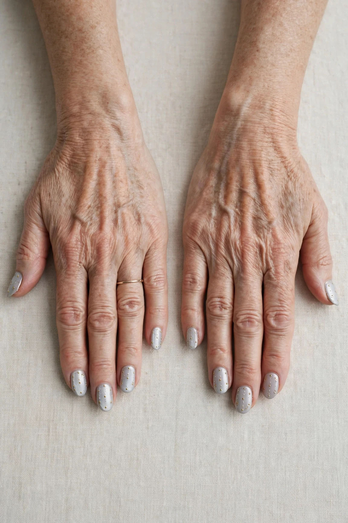 20 Icy Silver Frosted Nail Designs For Women Over 60 For Winter Weddings That Are Chic, Warm and Elegant 21 Almond Icy Silver Frosted Nail Designs with a pearl shimmer finish and tiny gold dots